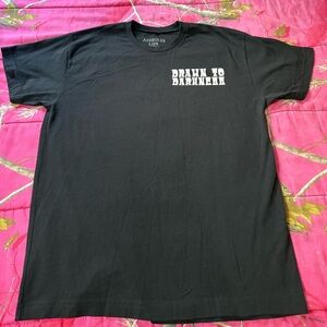 Assholes Live Forever T-shirt by Linda Finegold